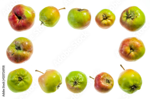 Frame of whole apples on a white background