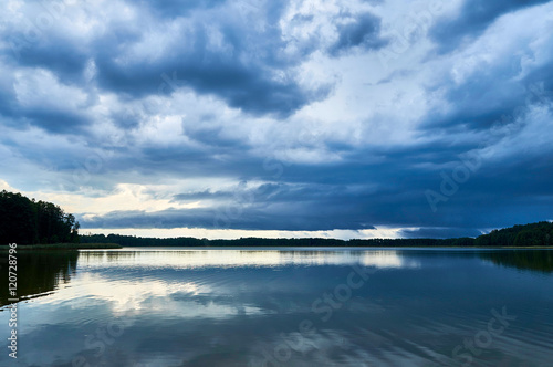 Fototapeta Naklejka Na Ścianę i Meble -  Dramatic Storm Clouds over beautiful Lemiet lake in Mazury district, Poland. Fantastic travel destination.