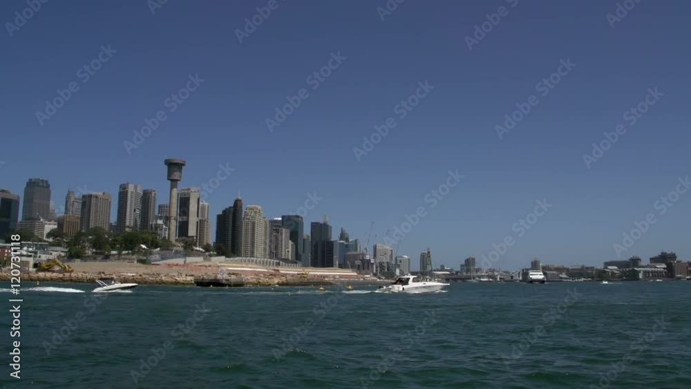 On a ferry with the skyline of Sydney with boats passing by On a ferry with the skyline of Sydney with boats passing by