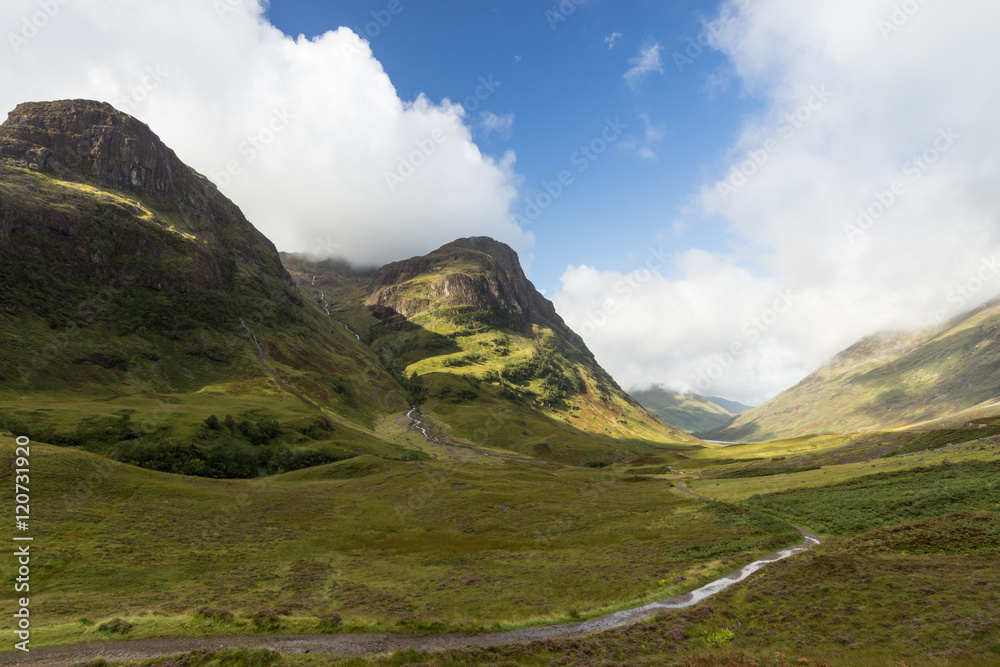 Nice green summer valley in the scottish highlands. Panorama landscape Scotland. Nice green summer valley in the scottish highlands. Panorama landscape Scotland.