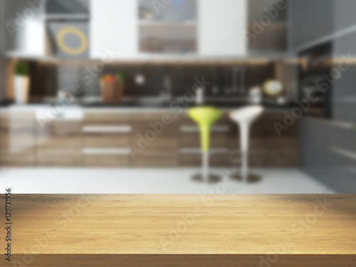 empty wooden desk with blurred kitchen background