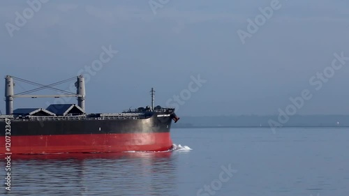 Cargo freight ship navigating the ocean photo