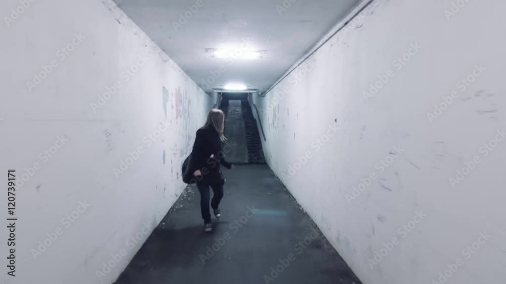 frightened scared woman in panic running away from murdered rapist bad man front view horror dark mood uhd 4k