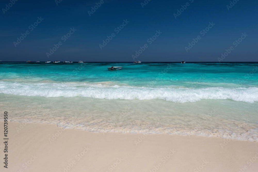 Water clear at the exotic beach with blue sky Water clear at the exotic beach with blue sky