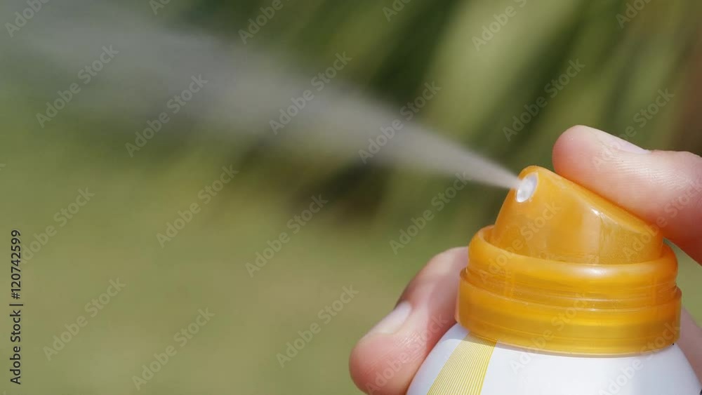Aerosol spray for sun protection being released, in slow motion