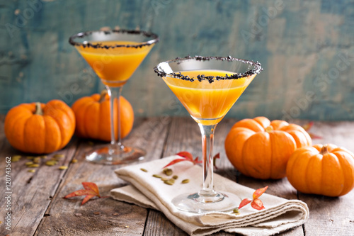 Pumpkin martini cocktail with black salt rim photo