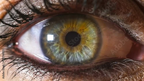 iris pupil contracting slowmotion,female green make up eye
