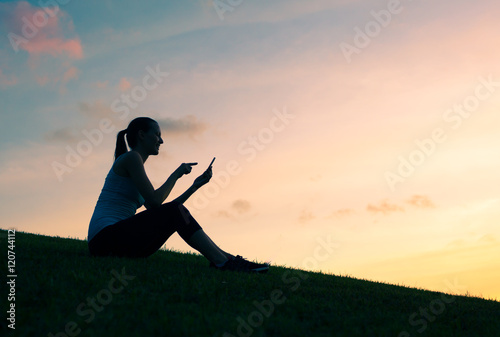 Girl using her smartphone outdoors. 