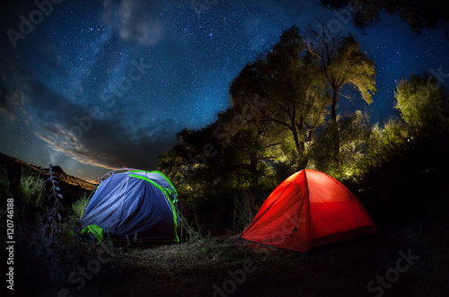 Tent camping under starry night