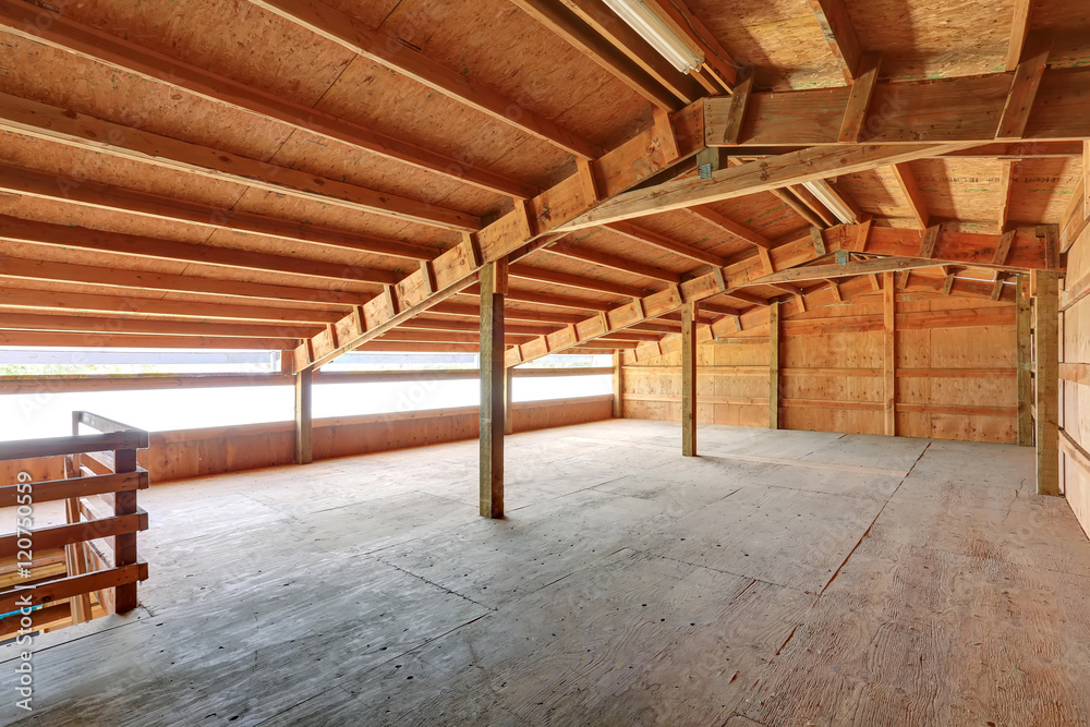 Empty barn inside with wooden trim