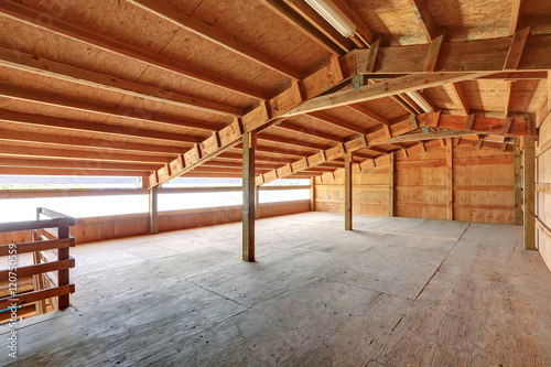Empty barn inside with wooden trim