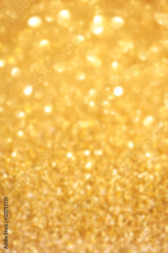 ..Golden glitter Christmas abstract background with defocused sp