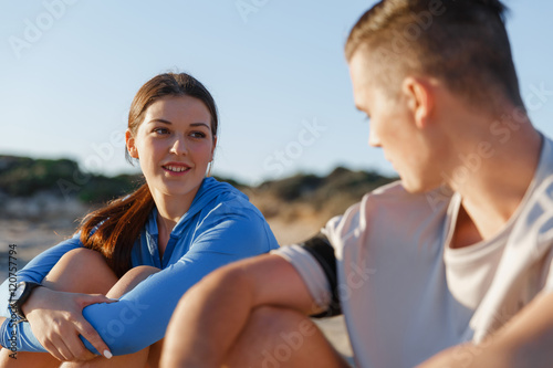 Couple in sport wear on beach