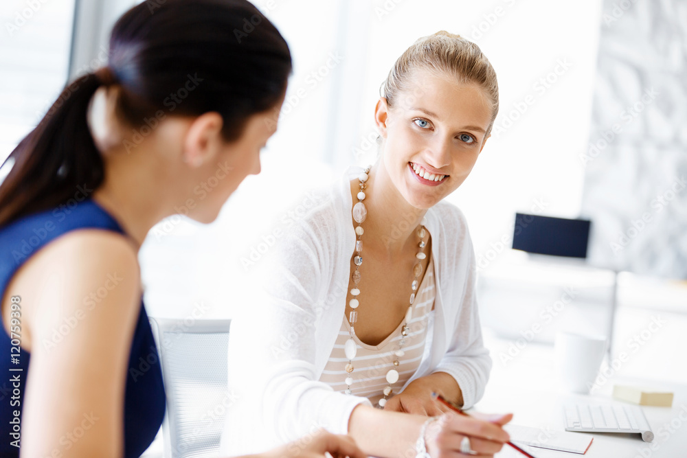 Fototapeta premium Two female colleagues in office