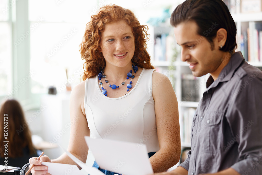 Fototapeta premium Two young people in office