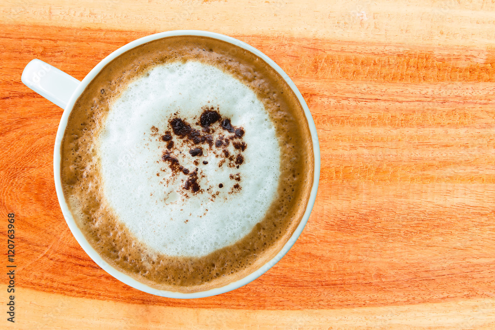 Hot coffee cup with clipping path top view on wood plank Hot coffee cup with clipping path top view on wood plank