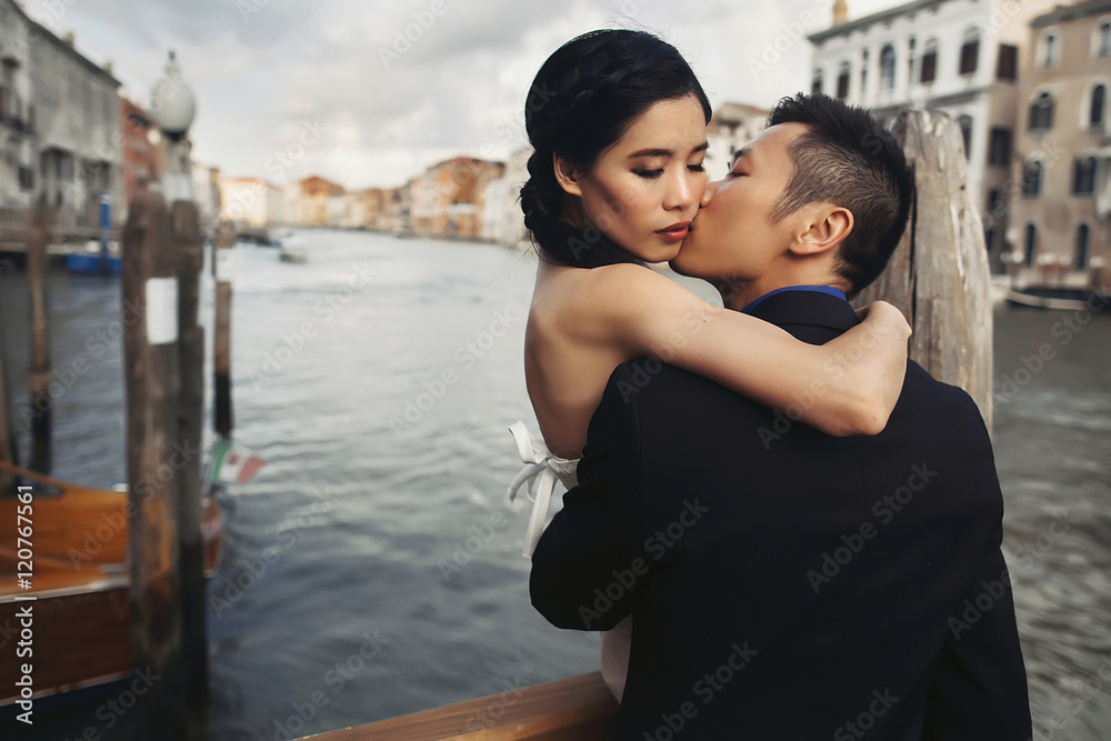 Newlyweds couple walking in Venice