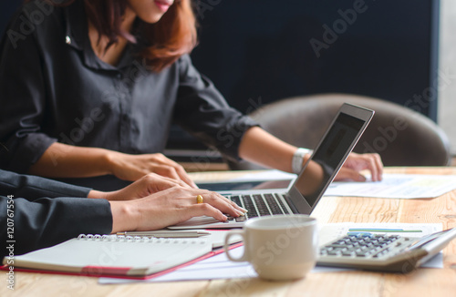 Close up of female accountant or banker making calculations. Sav photo