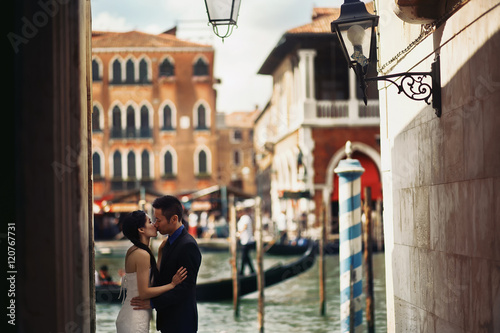 Newlyweds couple walking in Venice