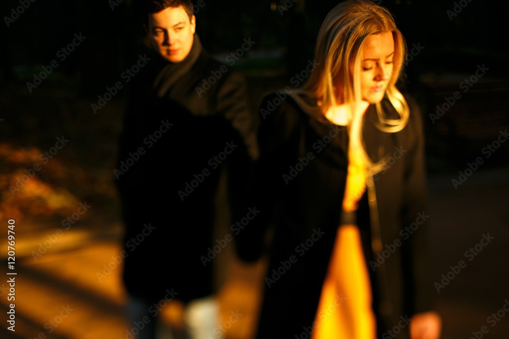 Beautiful young couple in the autumn park Beautiful young couple in the autumn park