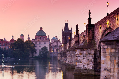 romantic red sunrise over Moldau river, Charles bridge, Old Town Bridge Tower (UNESCO), Old Town, Prague, Czech Republic 