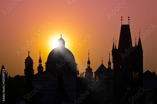 Charles bridge, Old Town Bridge Tower (UNESCO), Old Town, Prague, Czech Republic - skyline silhouette with rising sun