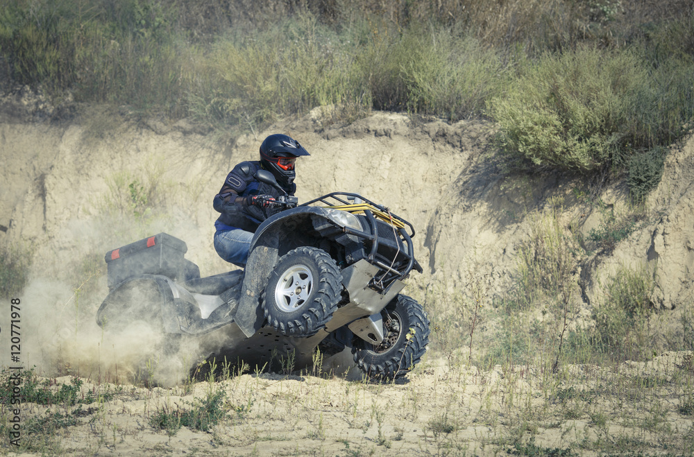 Racing atv is sand.
