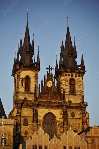 Two ancient towers of Tynsky chram on the Old Town Square (Staromestske namesti) during the sunset as a symbol of traveling, tourism and sightseeing in Prague