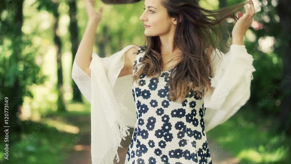 Pretty, romantic girl standing in the forest and looking happy
Pretty, romantic girl standing in the forest and looking happy