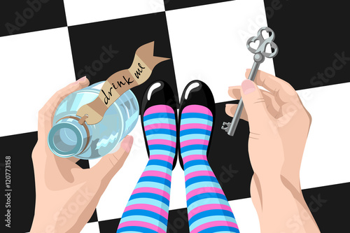 Alice in wonderland. Background. Key and  potion in hands against a floor. Alice looks at key and potion in the hands