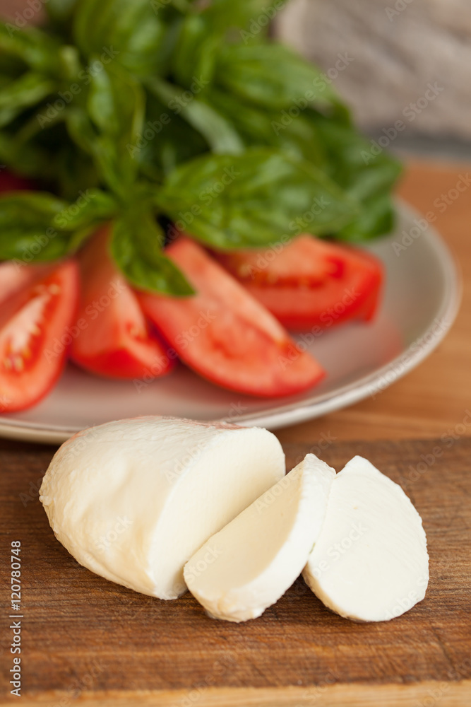 Caprese Salad. Tomato and Mozzarella slices with basil leaves. Caprese Salad. Tomato and Mozzarella slices with basil leaves.