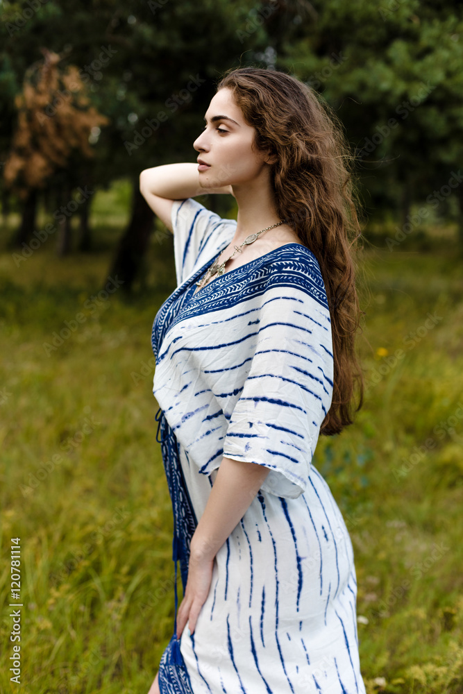 Young girl in folk clothes in fields. Fashion photo, folklore style Young girl in folk clothes in fields. Fashion photo, folklore style