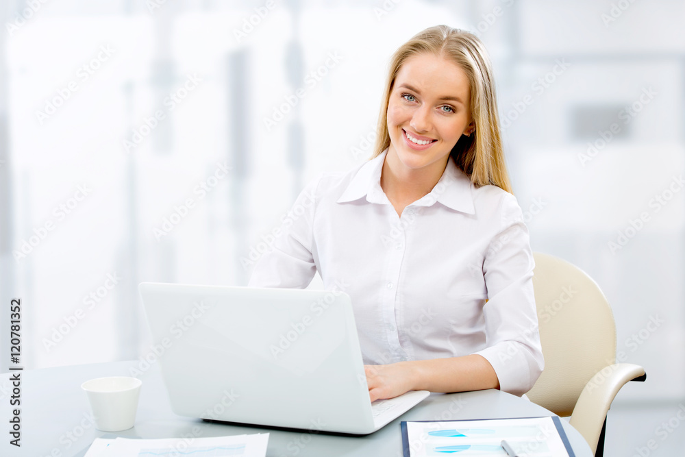 Young business woman using computer at office Young business woman using computer at office