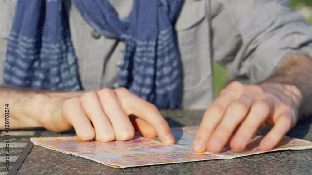 Toruist looking on the map and searching a way
Toruist looking on the map and searching a way