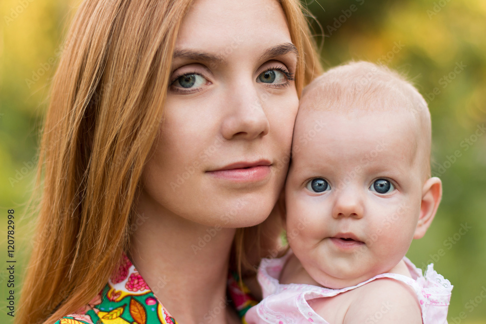 Portrait of young mom with her cute baby girl Portrait of young mom with her cute baby girl