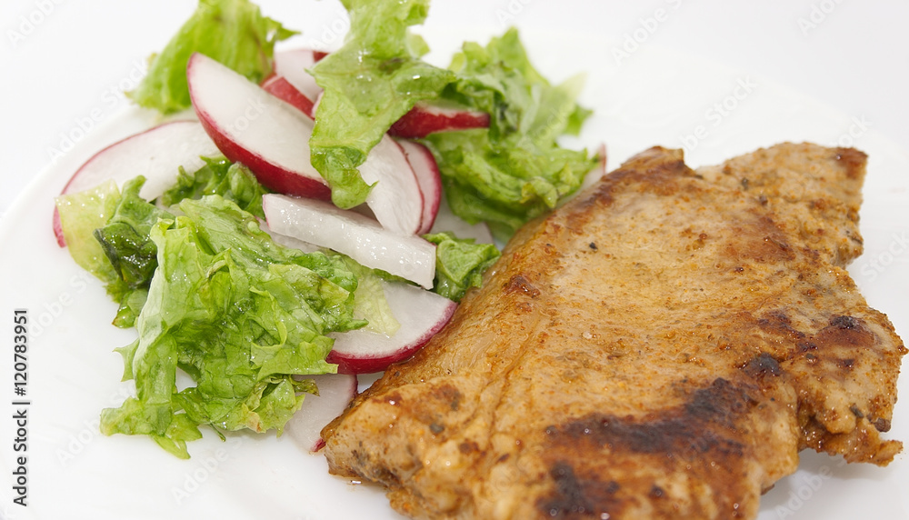 Steak meat grilled with salad made with radish, fresh lettuce an Steak meat grilled with salad made with radish, fresh lettuce an