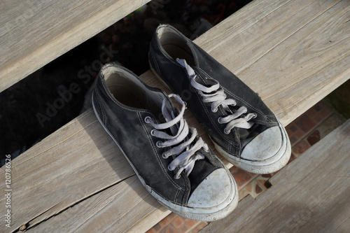 Sneakers shoes on wooden floor