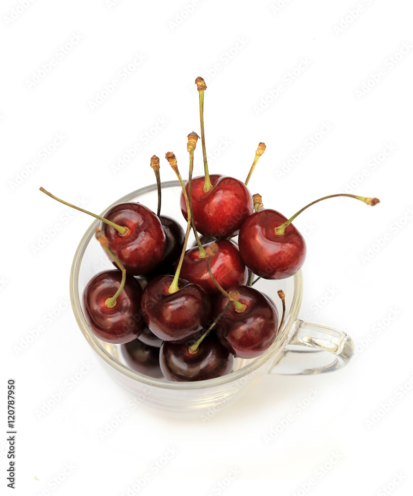 Delicious red cherry in glass on white background. Delicious red cherry in glass on white background.