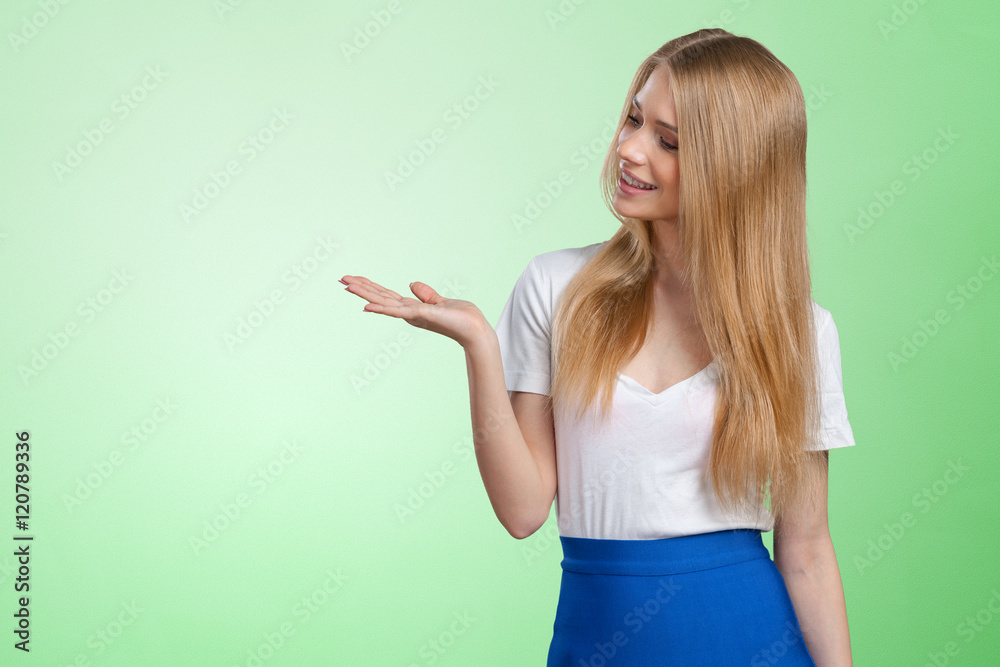 smiling young woman pointing smiling young woman pointing