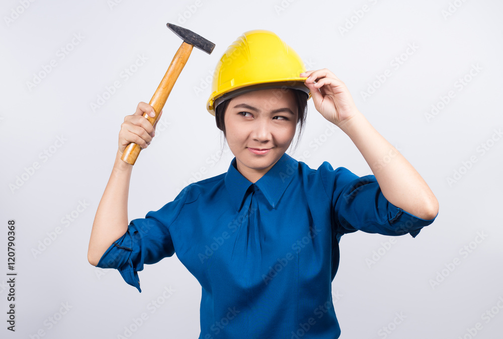 Engineer girl holding a hammer