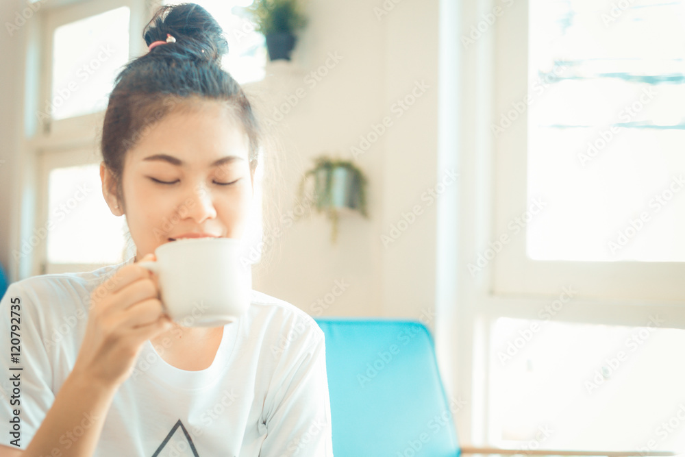 Woman drinking hot latte coffee white cup sitting on sofa cozy r Woman drinking hot latte coffee white cup sitting on sofa cozy r