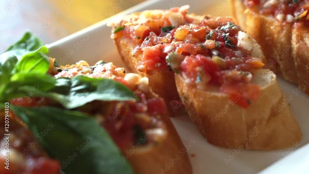 Antipasto Bruschetta, baguette slices topped with tomatoes basil mixed sauce Antipasto Bruschetta, baguette slices topped with tomatoes basil mixed sauce