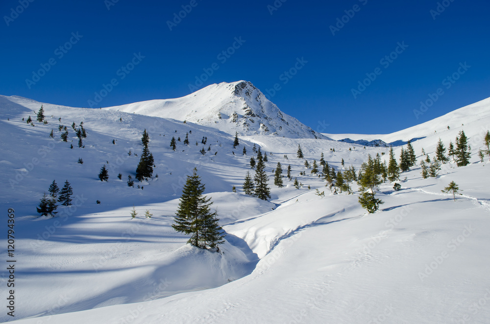View of a lonely peak in gorgeous clear winter day