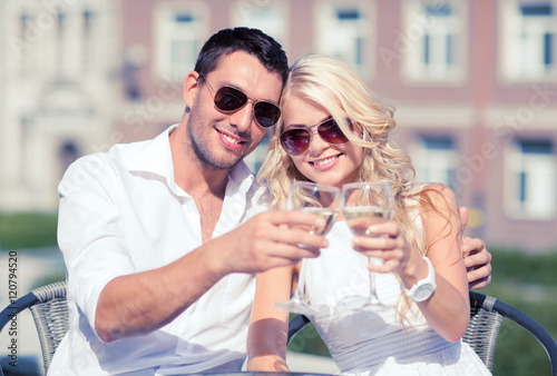 couple drinking wine in cafe