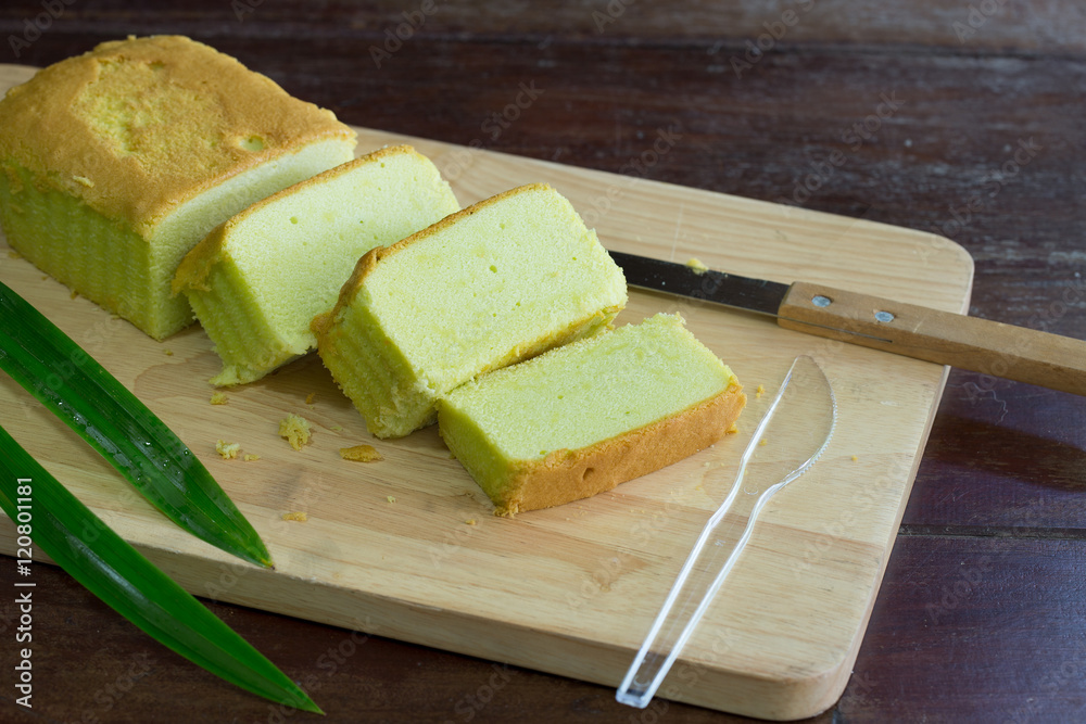 Pandan cake on wooden chopping board / Select focus Pandan cake on wooden chopping board / Select focus
