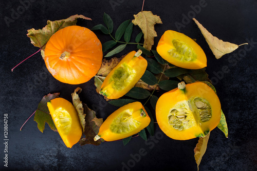 autumn composition with pumpkin and leaves photo