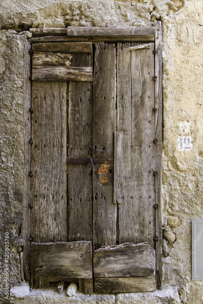door of wooden plank with bolts of old grunge house door of wooden plank with bolts of old grunge house