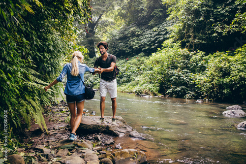 Couple in forest by the stream