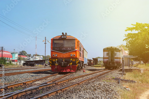 orange diesel engine locomotive train