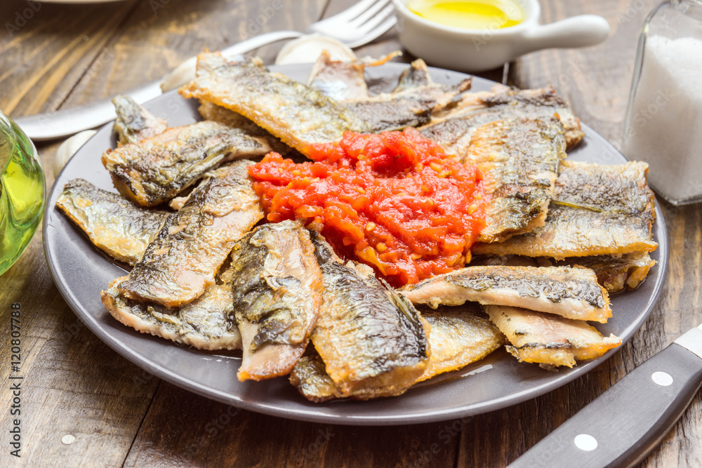 sardine fillets fried with tomato sauce
